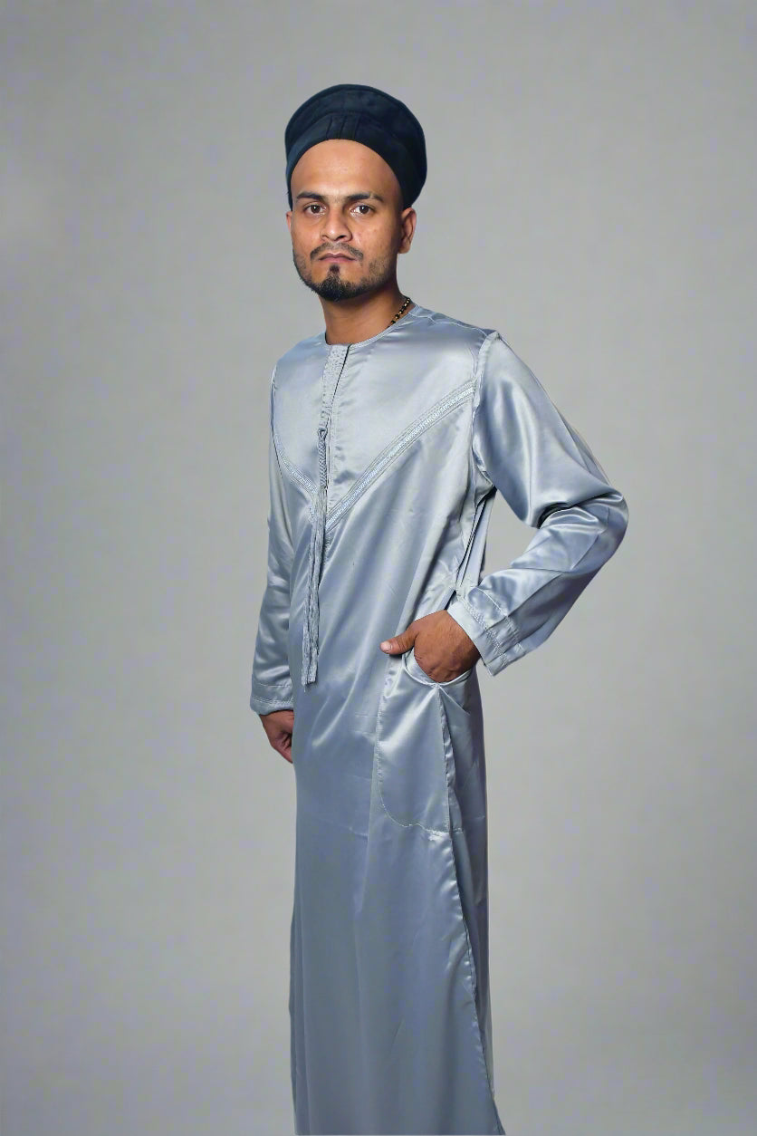 Man wearing a reflective silver outfit on a white background