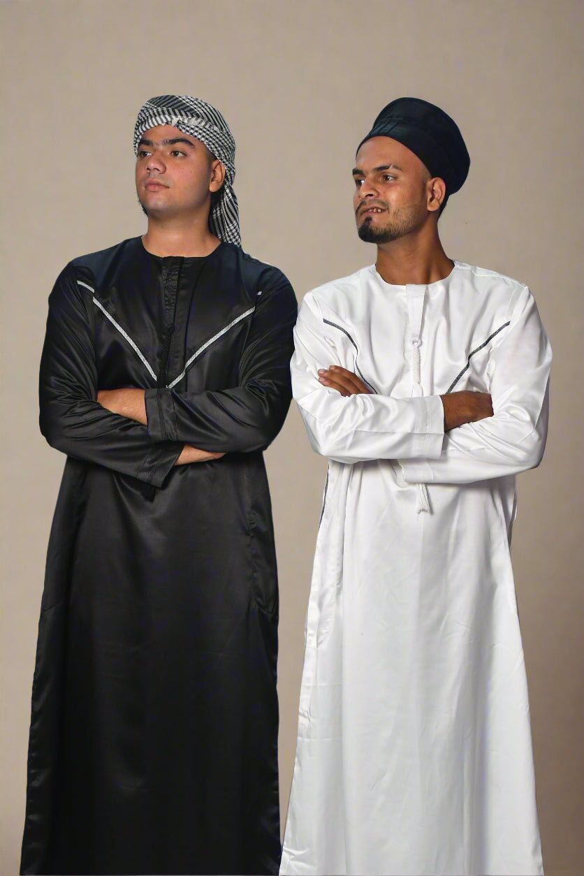 Two people wearing black and white outfits on a white background